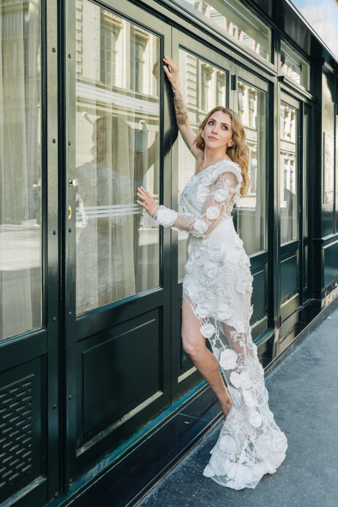 Bride posing outside a Parisian building after their Shangri-La Paris destination wedding, captured by Fioroni Photography, a destination wedding photographer based in Los Angeles